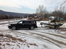 flex towing boat in snow